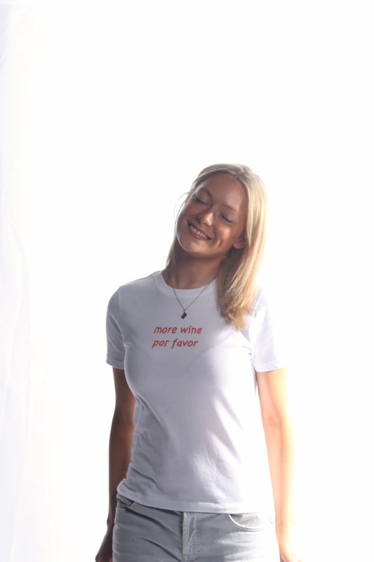 The More Wine Por Favor Baby Tee White